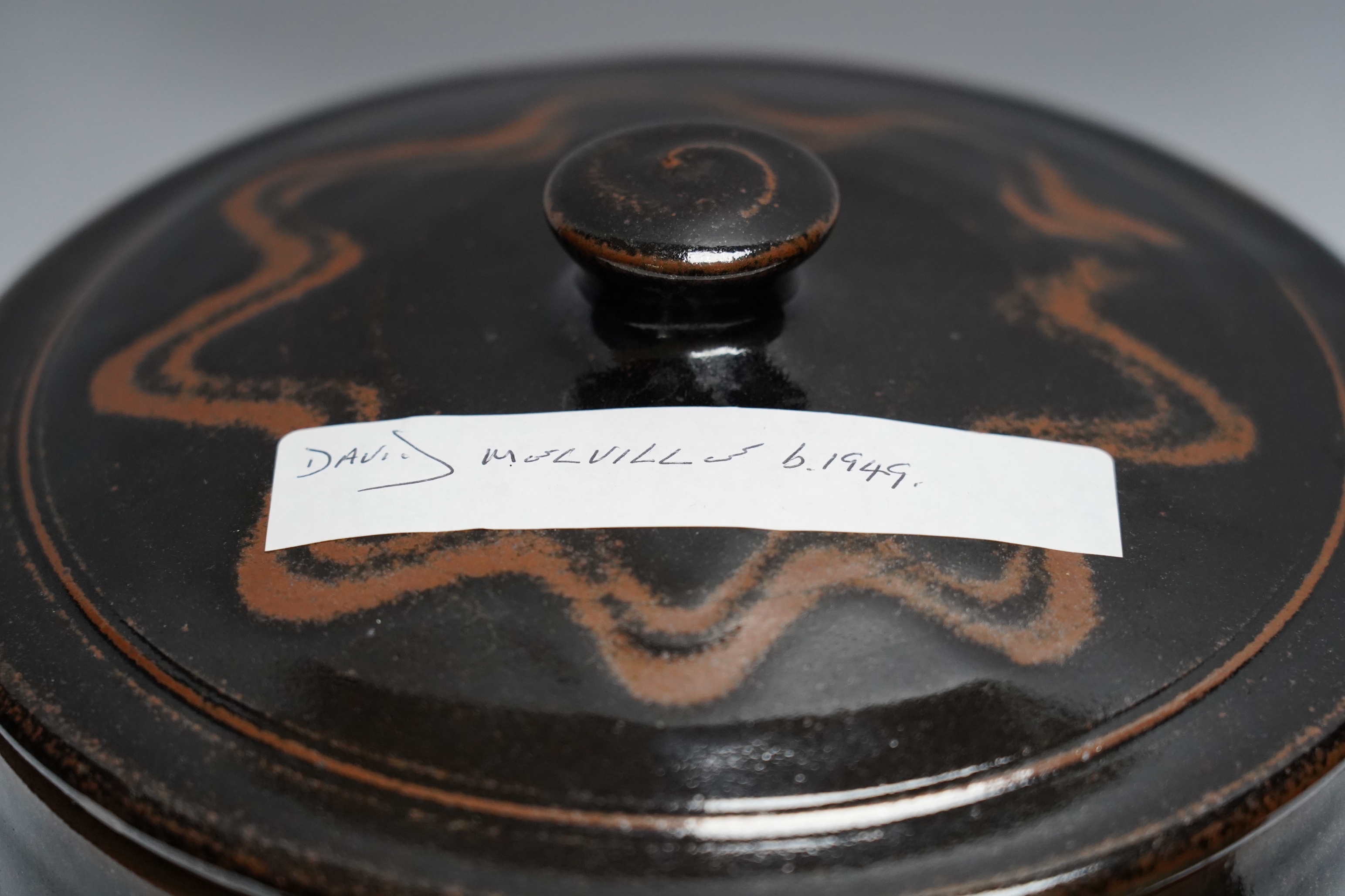 A David Melville studio stoneware pot and cover, a large dish and plate, largest 30cm diameter, a Raku ware pottery vase, a Leiard dish, a dish and a grey glazed vase, Raku vase 17.5cm high. Condition - varies, fair to g
